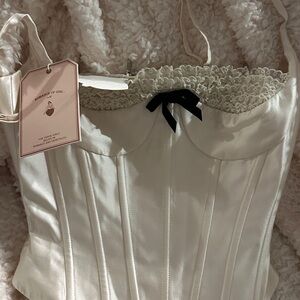 Cream Corset with Black Bow by For Love And Lemons